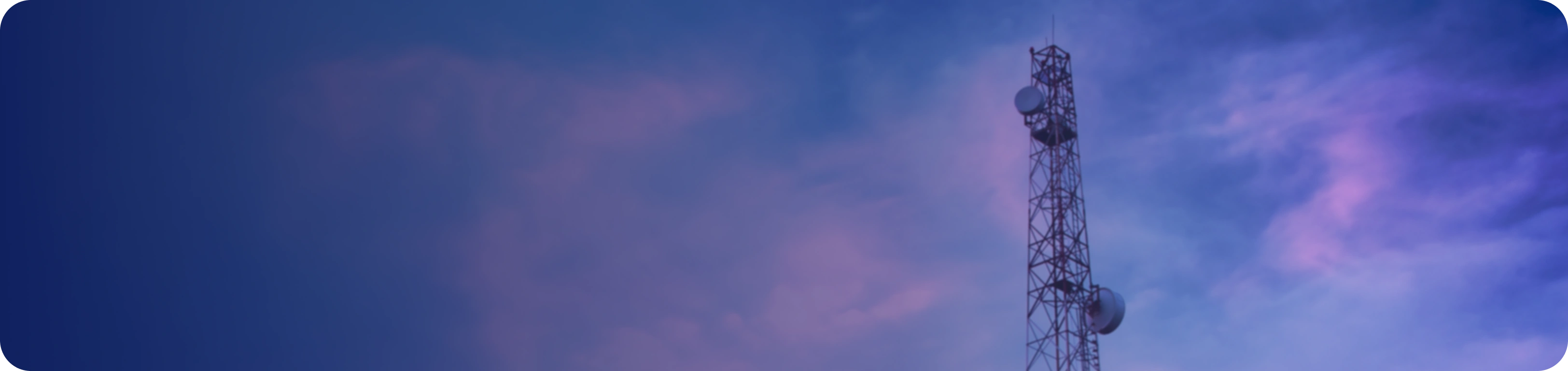 Telecommunications tower against a sunset sky